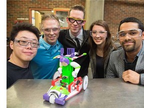 From left: Kelvin Duong, Tyler Thagard, Kyle Keep, Sarah Toogood, and Khilesh  Jairamdas. Inspired by the Buzz Lightyear ride at Disneyland, University of Alberta engineering students have designed and built robotic vehicles capable of navigating a maze, using on-board cameras to identify targets along the route and cross a finish line within a set time. The student teams will launch their vehicles March 30th in a competition that forms part of their Mechanical Design I final exam. At the beginning of the course, each team is given the same materials and resources, including access to a fully equipped shop, 3-D printers and the expertise of technicians in the Department of Mechanical Engineering in Edmonton, March 30, 2015.