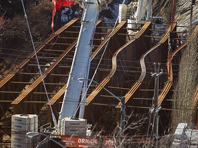 Groat Road will be closed indefinitely and completion of the 102nd Avenue Bridge could be delayed a year after four steel girders buckled early Monday during installation at the project.