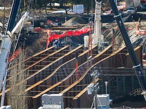 Groat Road will be closed indefinitely and completion of the 102nd Avenue Bridge could be delayed a year after four steel girders buckled early Monday during installation at the project.