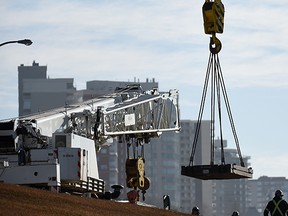 A large crane gets assembled at the south end of Groat Road in Edmonton on Tuesday Mar. 17, 2015.