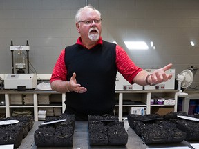 Hugh Donovan, Constructions Services Engineer with the City of Edmonton shows different samples of asphalt tested in the City of Edmonton's quality assurance lab.