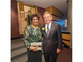 Retiring University of Alberta President Indira Samarasekera with of U of A board chair Doug Goss Wednesday night at a Winspear Centre community celebration honouring the president's 10 years of service. In the background is the portrait of Samarasekera by David Goatley, unveiled that night at the celebration. The president selected the artist and chose the Old Arts Building as the setting for the portrait saying it embodies a sense of the university's history. The portrait will join other presidential portraits as part of the U of A's art collection installed in the South Academic Building.