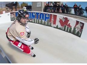 Olivier Larouche of Canada enters the finish area Thursday at the Crashed Ice event at the Shaw Conference Centre in Edmonton.