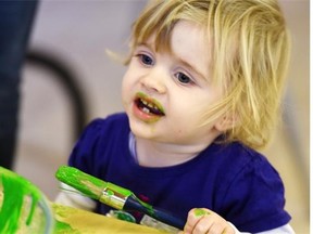 Paint might taste gross, but it won’t hurt Flora Ani, 1. Toddlers and kids in Val Johnstones’ play classes are encouraged to explore all their senses.