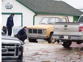 Police Tuesday investigate the scene of the city’s fourth homicide of the year.