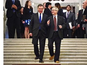 Premier Jim Prentice (L) and Minister of Finance Robin Campbell after the Alberta Budget 2015 was tabled at the Legislature in Edmonton, March 26, 2015.