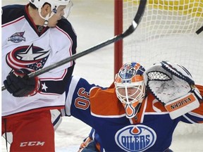Rene Bourque of the Columbus Blue Jackets screens Ben Scrivens as the puck sails over the Edmonton Oilers goalie and into the net for a goal by Ryan Johansen during Wednesday’s National Hockey League game at Rexall Place.