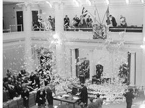 Reporters in the press gallery send down a A traditional paper shower down on the MLAs on the floor of the Alberta legislature chamber signalling the last day of the spring session in 1969.