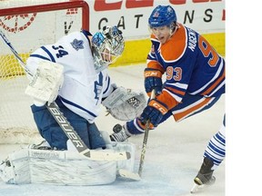 Ryan Nugent-Hopkins (93) gets a shot on goalie James Reimer (34) as the Edmonton Oilers play the Toronto Maple Leafs at Rexall Place in Edmonton , March 16, 2015.