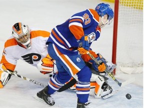 Ryan Nugent-Hopkins scores the game-winning goal in overtime for the Edmonton Oilers against Philadelphia Flyers goaltender Ray Emery in Saturday’s NHL game at Rexall Place.