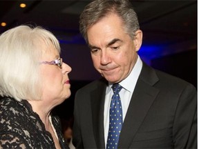 Sharon Carry, left, CEO and president of Bow Valley College, chats with Premier Jim Prentice after his speech to the Women’s Executive Network at the Westin in Calgary on Wednesday.