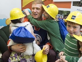 Grade 1 students at Princeton School gathered around Oilers forward Rob Klinkhammer as the Edmonton Oilers Community Foundation launched its annual EPCOR Share A Book program.