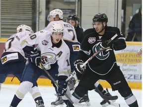 Spruce Grove Saints centre Tyler Busch, centre, along with fellow forwards Lukas Biensch and Parker Mackay have a collective 360-degree view of the play during Friday’s Alberta Junior Hockey League playoff game against the Sherwood Park Crusaders at Grant Fuhr Arena in Spruce Grove