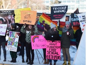 U of A students came out to protest in front of graphic signs set up in the quad by anti-abortion protesters in Edmonton on Tuesday, March 3, 2015.