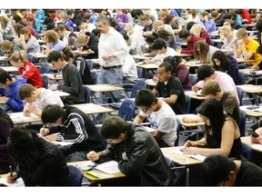 Students write exams at an Edmonton high school, a practice that is the focus of renewed debate about how much weighting should be given to the final marks.