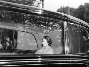 In this 1955 file photo, Princess Margaret rides in a limousine on her way to Clarence House in London. Rumours have long circulated that the Princess was romantically involved with lawyer John Turner, who would go on to become prime minister of Canada for a brief period in 1984.