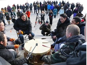 In this Dec. 10, 2013 file photo, Idle No More protesters play the warrior drum on the steps of Parliament Hill in Ottawa. Letter writer Anne Hamre says there’s little difference between Canada’s reserve system today and the apartheid practised in the late 20th century in South Africa.