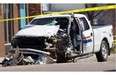 In this photo from May 10, 2014, RCMP officers investigate the scene of a gun battle in St. Paul, Alta. The day earlier, John Carlos Quadros shot and killed a local priest, then drove to the RCMP detachment and shot at officers, before killing himself. Three RCMP officers were wounded in the chase and shootings.