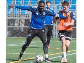 Tomi Ameobi, left, and Daryl Fordyce at the FC Edmonton practice at Clarke Stadium in Edmonton April 9, 2015.