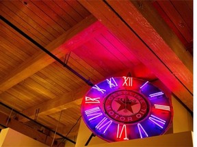 Bob Lalonde's neon sign greets guests as they enter his condo built in the historic John Deere warehouse.