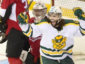 University of Alberta Golden Bears forward Levko Koper, who was named the MVP of the CIS championship final, celebrates after Kruise Reddick’s third-period goal against the UNB Varsity Reds on Sunday at Halifax.
