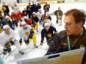 University of Alberta Golden Bears head coach Ian Herbers runs a hockey practice at Clare drake arena in Edmonton, Alberta, January 3, 2013.