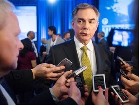 In the wake of his controversial “look in the mirror” remark about Alberta’s fiscal mess, Premier Jim Prentice speaks to the media during the Manning Centre’s conservative networking conference in Ottawa on March 6, 2015.