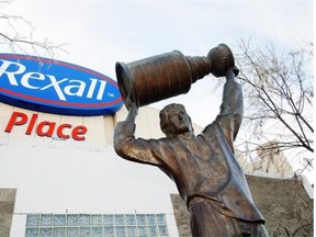 The Wayne Gretzky statue stands outside Rexall Place, home of the Oilers. It’s almost certain that the 41-year-old arena will be demolished when the Oilers move to their new downtown arena, David Staples writes. Edmonton Journal/file