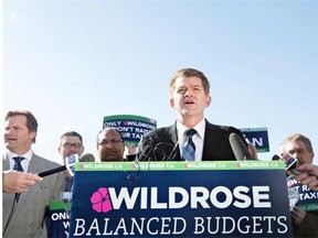 Wildrose Leader Brian Jean discusses his party’s priorities and financial plan during a campaign stop in Edmonton on April 9, 2015.