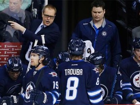 Winnipeg Jets head coach Paul Maurice talks to his players during a break in first period NHL action against the St. Louis Blues in Winnipeg on Thursday, March 19, 2015.