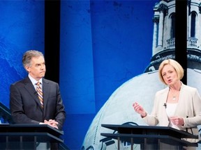Alberta Progressive Conservative Leader Jim Prentice and NDP Leader Rachel Notley discuss math during the leaders debate on April 23, 2015.