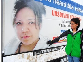 Amber Tuccaro’s mother Vivian Tuccaro touches the photo of her daughter at the unveiling of a billboard in hopes of advancing the case in the missing woman. Amber’s skull was found by horseback riders on a property near Leduc in 2012, in the same area where Delores Brower’s skeletal remains were found this month.