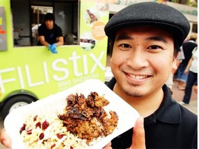 Ariel’ Del Rosario’s stands in front of his food truck, Filistix in July 2009.