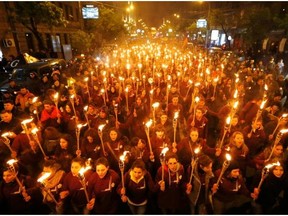 Armenians walk with torches to the monument to the victims of mass killings by Ottoman Turks, in Yerevan, Armenia, Friday, April 24, 2015.