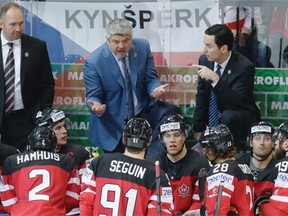 Canada coach Todd McLellan talks to his players during the world hockey championship semifinal against the Czech Republic in Prague, Czech Republic, on May 16, 2015.