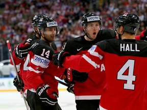 Look familiar? Jordan Eberle and Taylor Hall celebrate another goal for Team Canada, this one by Eberle who opened the scoring in Canada's 6-3 win over Czech Republic on Monday.  Matt Duchene (centre) also joins the party.