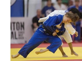 Catherine Beauchemin-Pinard of Canada (in blue) won the bronze medal after throwing Hana Carmichael of the United States in the 57 kg class of the Pan American judo championships at the Saville Community Sports Centre on Saturday.