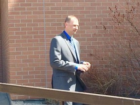 Const. Allan Mayer leaves the courthouse in Wetaskiwin after testifying Tuesday, April 21, 2015. Sawyer Robison has pleaded not guilty to two counts of attempted murder as well as assault and weapons charges.
