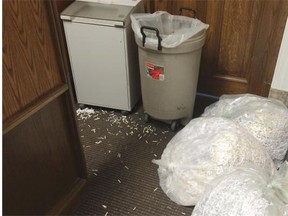 A couple bags of shredded papers rest Wednesday inside the common area of the offices of the ministers of energy and of infrastructure. The commissioner’s office issued a news release late Thursday, in part to answer questions raised by the public and media about shredding in the wake of the Tories’ defeat in Tuesday’s election.