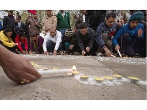 A crowd of about 200 people takes part in a vigil for victims of the earthquake in Nepal, organized by the city’s Nepalese community on May 2, 2015, at Churchill Square in Edmonton.