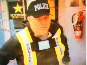 Curtis John Ulmer in his fake police uniform on May 15, 2014. Photo taken from a gas station surveillance camera and presented in court on Jan. 9, 2015.