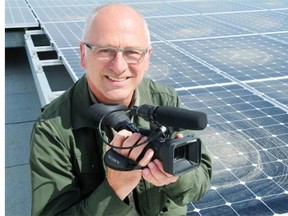 David Dodge Producer, Green Energy Futures poses for a photograph on the roof at the Mosaic building located in Edmonton.