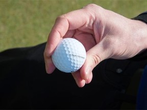 Derek Kovacs, an associate golf professional at the Edmonton Country Club, makes a putt at the Mill Woods Golf Course.