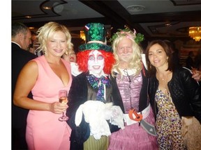 Dorothy Kozina and Mad Hatter husband-cum-waiter Anton Morgulis (left) with Nick Lees and Belen Isbister at the Children’s Wish Foundation gala last Thursday at the Chateau Lacombe.
