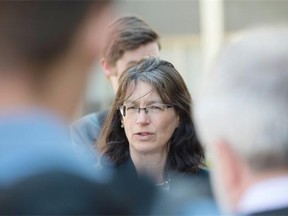 Edmonton Catholic school board trustee Patricia Grell leaves the downtown office. She spoke out about the district’s decision to require a transgender child to use an all-gender bathroom, as opposed to the girls’ washroom. Transgender woman Marni Panas offers her support to Grell outside the school board office.