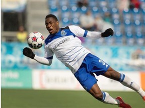 FC Edmonton’s Eddie Edward stops a pass with his chest against the Minnesota United FC during a North American Soccer League game at Clarke Field on May 3, 2015.