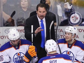 Edmonton Oilers interim head coach Todd Nelson gives direction from the bench during an NHL game against the Winnipeg Jets at the MTS Centre in Winnipeg on Feb. 16, 2015.