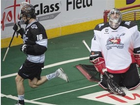 Edmonton Rush captain Chris Corbeil scores on Calgary Roughnecks goaltender Frankie Scigliano during a National Lacrosse League playoff game at Rexall Place on May 15, 2015.