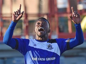 FC Edmonton’s Tomi Ameobi celebrates after scoring a goal on Ottawa Fury FC goalkeeper Romuald Desire Peiser during the second leg of the Amway Canadian Championship quarter-final soccer game at Clarke Field on Wednesday.