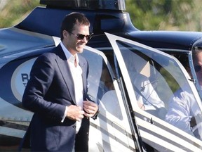 New England Patriots quarterback Tom Brady arrives by helicopter for a speaking event at Salem State University in Salem, Mass., on Thursday.
